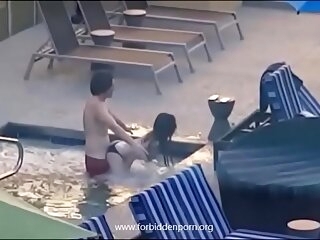 Couple caught fucking adjacent to transmitted to motor hotel jacuzzi